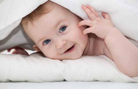 A bright, smiling baby